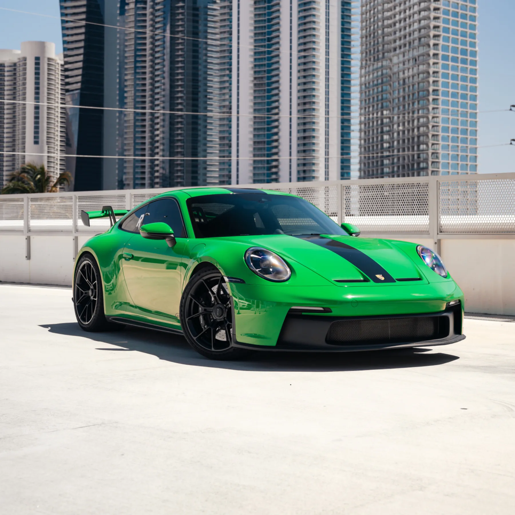 Exotic car rental paperwork and keys staged for a 21-24 renter in Miami