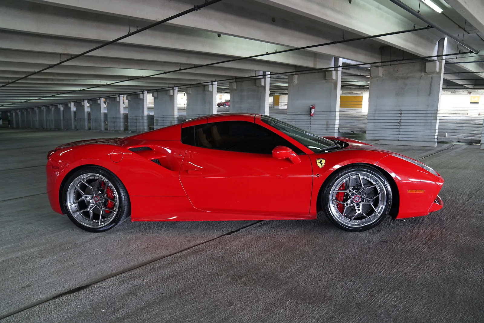 Red Ferrari 488 Spider parked in Miami with top down